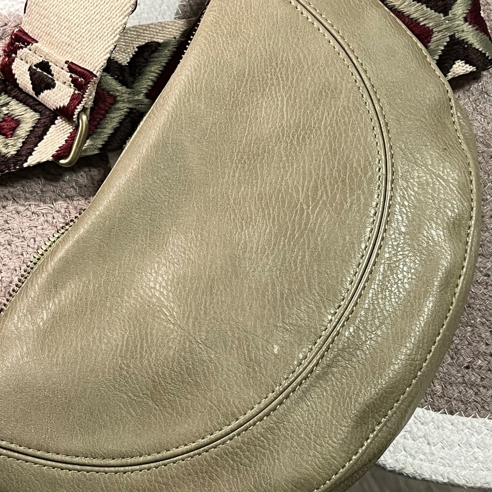 Anthropologie crescent-shaped crossbody purse light olive green